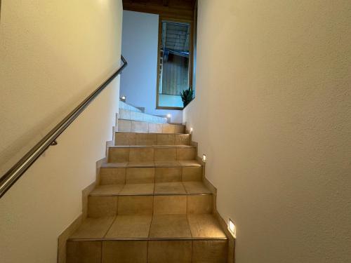 a staircase with lights on the side of a building at Ferienhaus Sellraintal in Gries im Sellrain