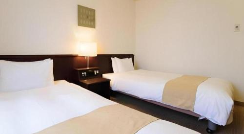 Ένα ή περισσότερα κρεβάτια σε δωμάτιο στο Chisun Hotel Utsunomiya