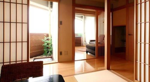a living room with a view of a living room at Luxury Wa Hotel Kaze No Kaori in Ito