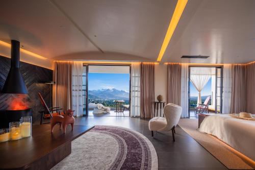 a hotel room with a bed and a fireplace at Lijiang Jijian Xiangwang SOOOAN Luxury Resort Hotel in Lijiang