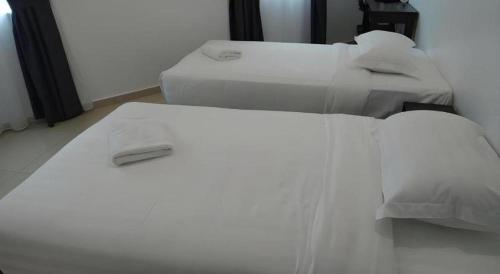 Katil atau katil-katil dalam bilik di Hotel Seri Geliga
