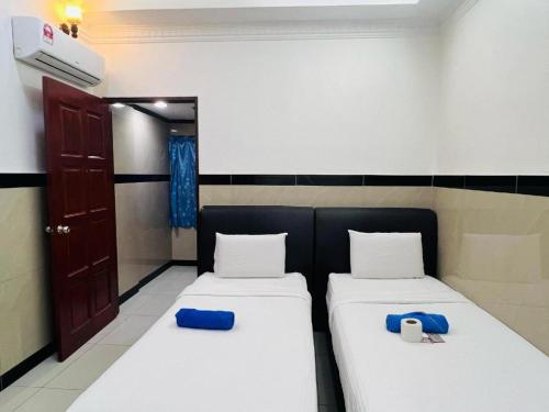 Letto o letti in una camera di Burmahtel Hotel