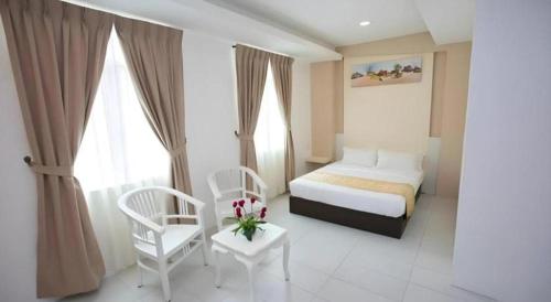 Ένα ή περισσότερα κρεβάτια σε δωμάτιο στο Skyview Hotel