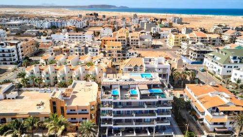 an aerial view of a city and the beach at Apartamentos Golfinho Dourado in Santa Maria