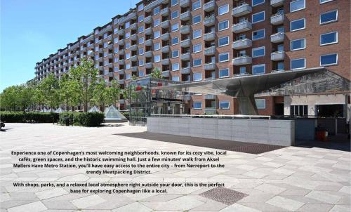 a large building with a sculpture in front of it at Bright, child-friendly, balcony, 50 meters from the subway in Copenhagen