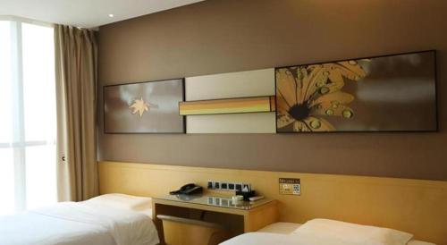 Postel nebo postele na pokoji v ubytování IU Hotels·Tongling Beidouxingcheng