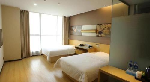 Postel nebo postele na pokoji v ubytování IU Hotels·Tongling Beidouxingcheng