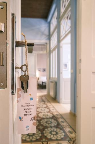 a room with a door with a key hanging from it at Beit Toureef - RESIDENCES in Beirut