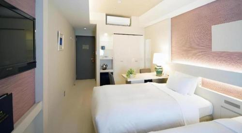 Hotel Riverge Akebonoにあるベッド