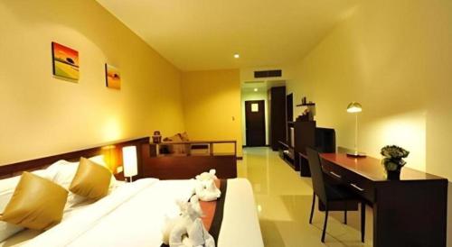 Кровать или кровати в номере Green World Palace Hotel