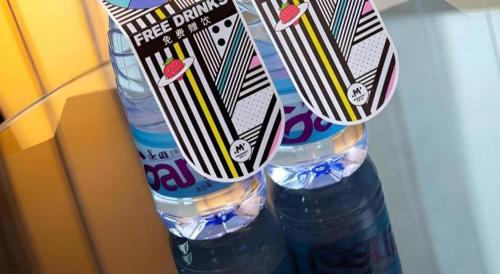 a stack of two bottles of water on a table at Radegast Hotel CBD in Beijing