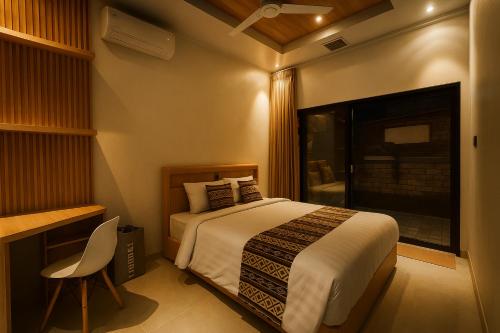 Ένα ή περισσότερα κρεβάτια σε δωμάτιο στο Nareswara Guest House