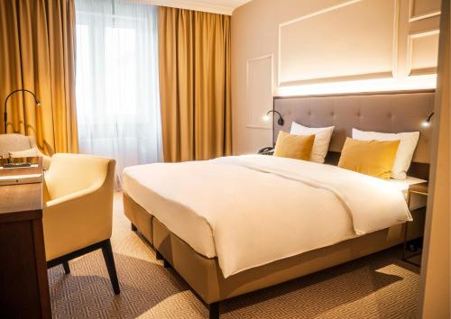 Parkhotel Kurhausにあるベッド