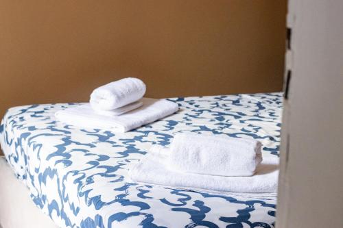 Ένα ή περισσότερα κρεβάτια σε δωμάτιο στο Eleganza e comfort nel cuore di Torino a due passi da Porta Nuova e dal Museo Egizio