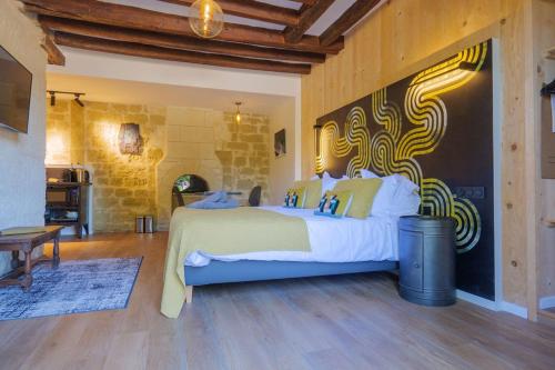 a bedroom with a large bed in a room at Château de Candes - Art & Spa in Candes-Saint-Martin