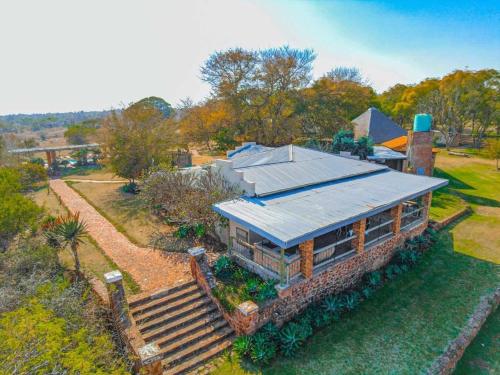 an overhead view of a house with a roof at KwaThabisile Bush Retreat in Cullinan