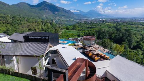 an aerial view of a villa with a resort at Lijiang Jijian Xiangwang SOOOAN Luxury Resort Hotel in Lijiang