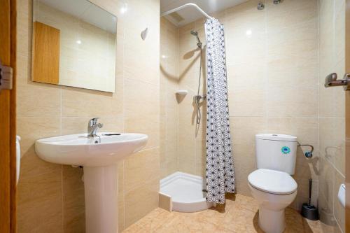 a bathroom with a sink and a toilet and a shower at Acrópolis Vidaber in Oropesa del Mar