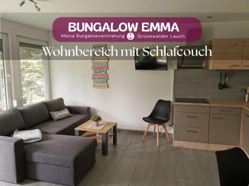 a living room with a couch and a table at Bungalow Grünewalder Lauch in Lauchhammer