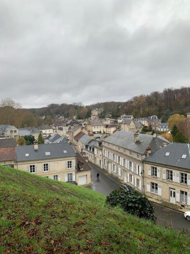 a view of a city from a hill with buildings at Hebergement insolite Boat Near Paris in Thourotte
