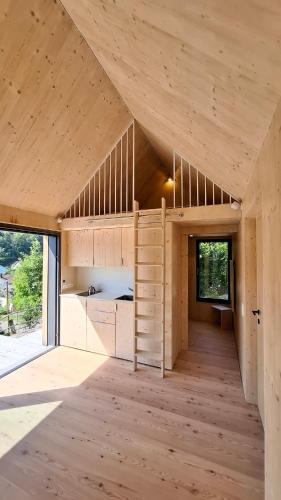 a large wooden room with a bunk bed in it at mini mal anders in Altmannstein