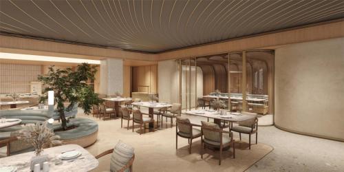 a rendering of a restaurant with tables and chairs at Hilton Bangalore Embassy GolfLinks in Bengaluru