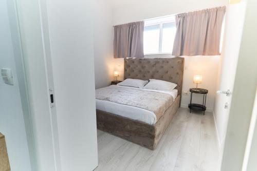 Ένα ή περισσότερα κρεβάτια σε δωμάτιο στο Apartments Lukas