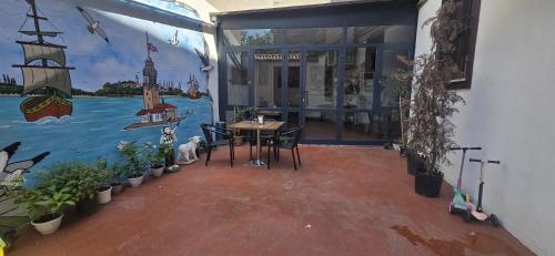 a room with a table and a painting on the wall at Grand Bedir in Istanbul