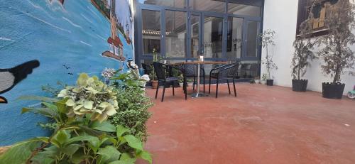 a patio with a table and chairs in a building at Grand Bedir in Istanbul