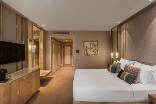 En eller flere senge i et værelse på Ela Excellence Resort Belek