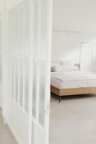 Ένα ή περισσότερα κρεβάτια σε δωμάτιο στο KAZA Loft