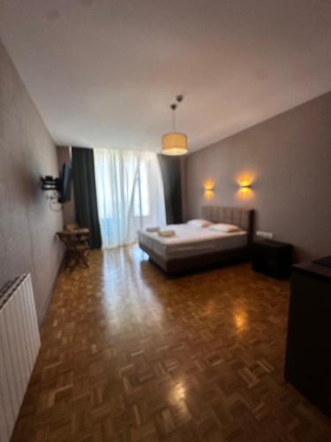 a bedroom with a bed in a room at Villa Sunlight in Gonio
