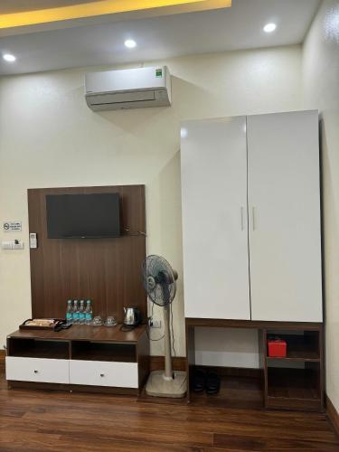 a room with a fan and a white cabinet at Cao Bang Eco Bistro & Stay in Cao Bằng