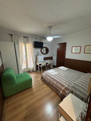 a hotel room with a bed and a table at B&B ABRUZZO in Sulmona
