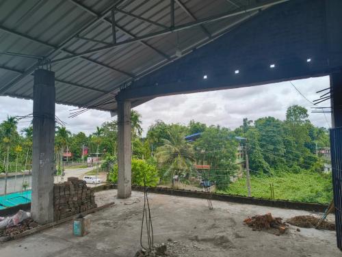 a large building with a view of a street at Aashray Independent Homestay Dibrugarh in Dibrugarh
