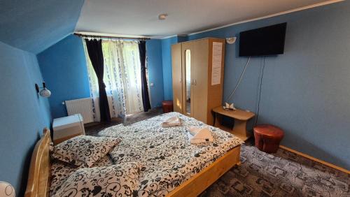 Ένα ή περισσότερα κρεβάτια σε δωμάτιο στο Casa Dobrin