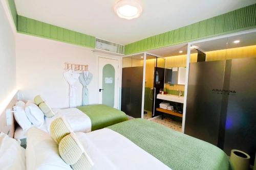 Postel nebo postele na pokoji v ubytování AKANARA · Yangchou Paradise Resort