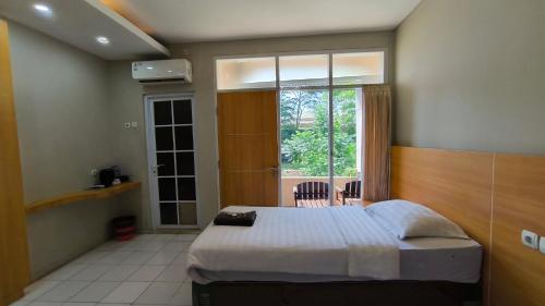 Katil atau katil-katil dalam bilik di Royal Kencana Hotel powered by Cocotel