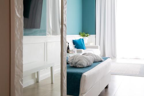 Ein Bett oder Betten in einem Zimmer der Unterkunft Bianco Riccio Suite Hotel