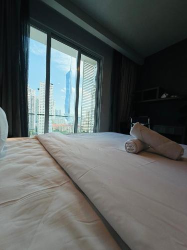 Ένα ή περισσότερα κρεβάτια σε δωμάτιο στο Ramad Serviced Suites KLCC