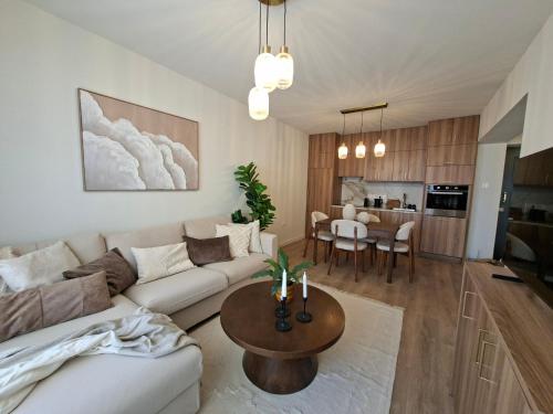 a living room with a couch and a table at The Serene Suite in Larnaka
