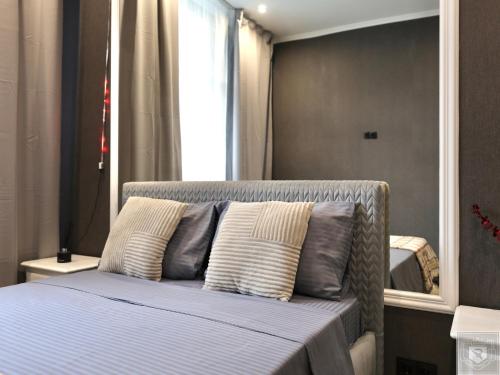 Ένα ή περισσότερα κρεβάτια σε δωμάτιο στο RentHouse Apart-Hotel Room #5