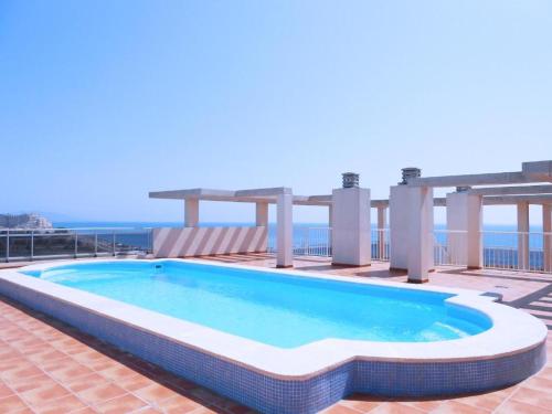a swimming pool on the roof of a building at Acrópolis Vidaber in Oropesa del Mar