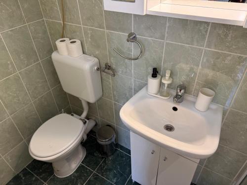 a bathroom with a toilet and a sink at Little Hungary Apartment in Budapest