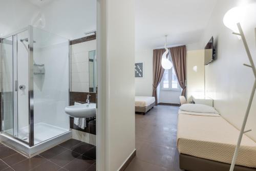 a bathroom with a shower and a sink at Maison Trevi in Rome