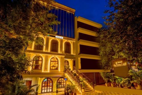 a building with a staircase in front of it at night at Treebo Golden Leaf in Rānchī