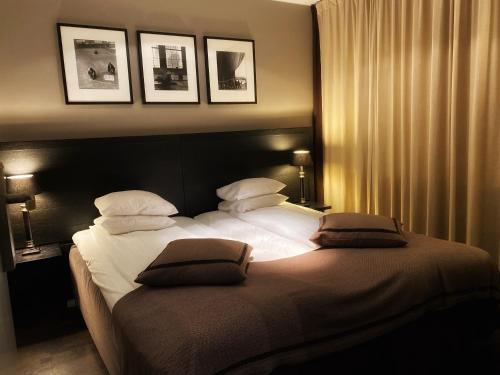 Postel nebo postele na pokoji v ubytování Hotel Villan