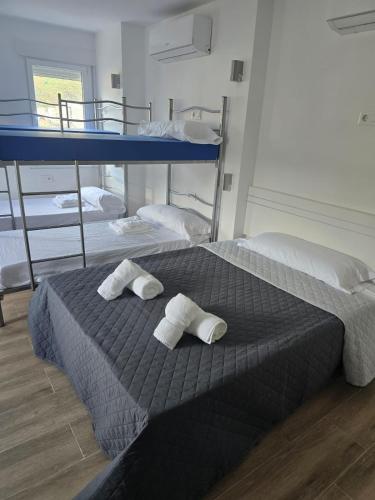 Ένα ή περισσότερα κρεβάτια σε δωμάτιο στο Albergue o Bailarin