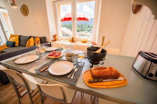 a table with food on it in a kitchen at Villa en plein cœur de Leysin in Leysin