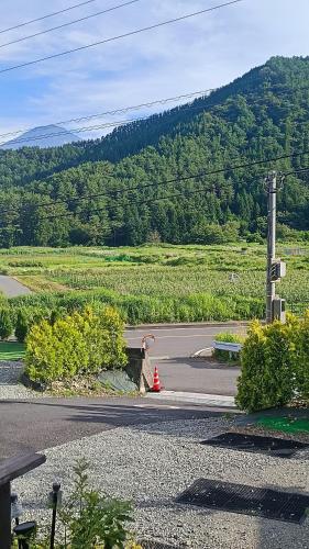 a road with a fire hydrant on the side of the road at Fuji Dome Glamping in Fujikawaguchiko